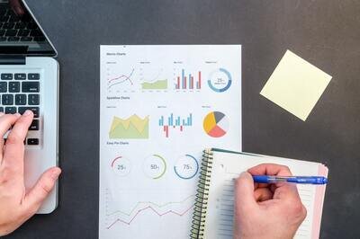 laptop, data sheet and notepad