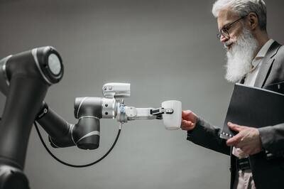 robot handing a man coffee